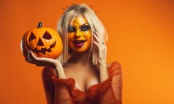woman-mask-with-halloween-pumpkin-yellow-background_780838-9815.jpg